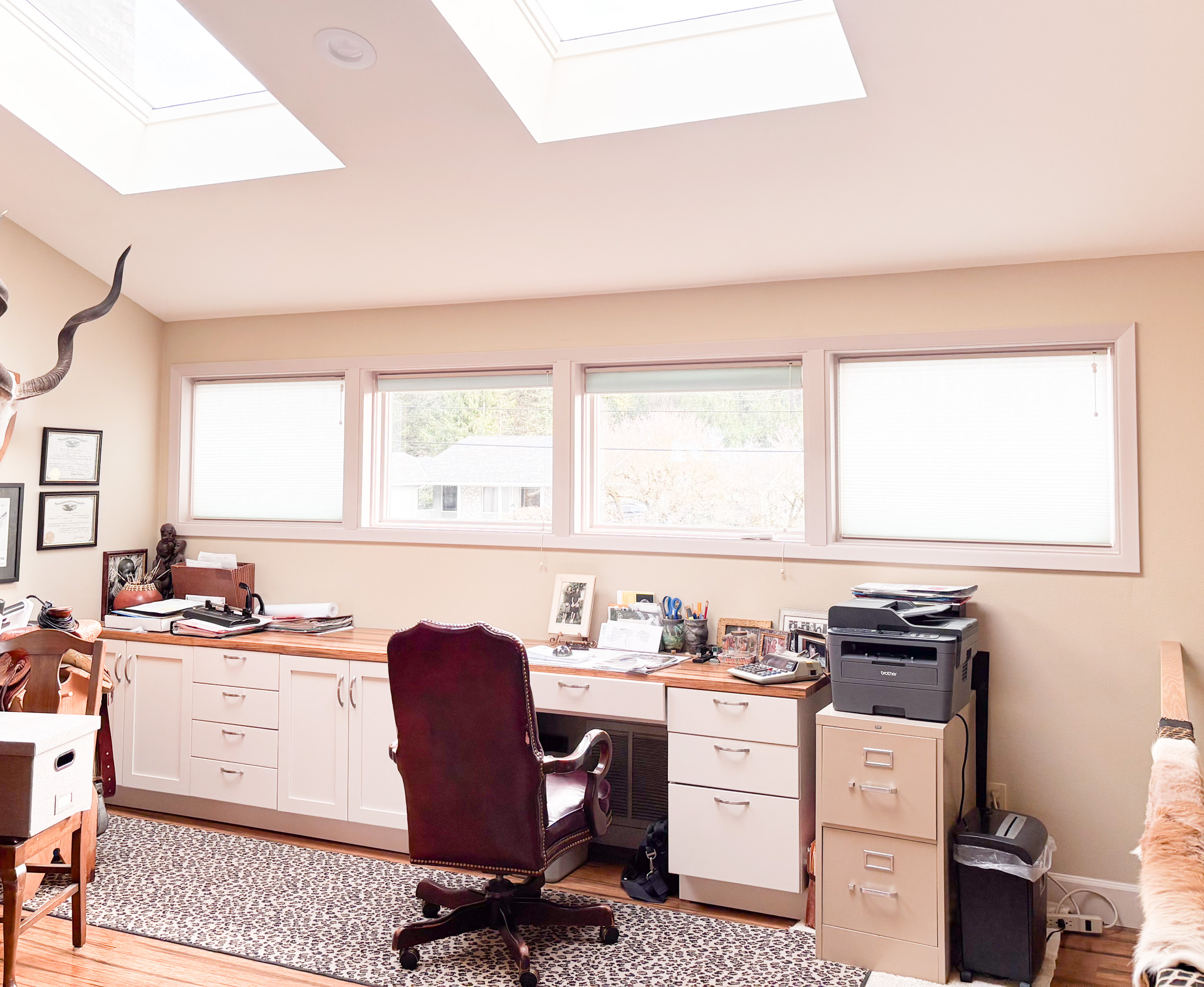 Office with custom built-in desk and cabinets